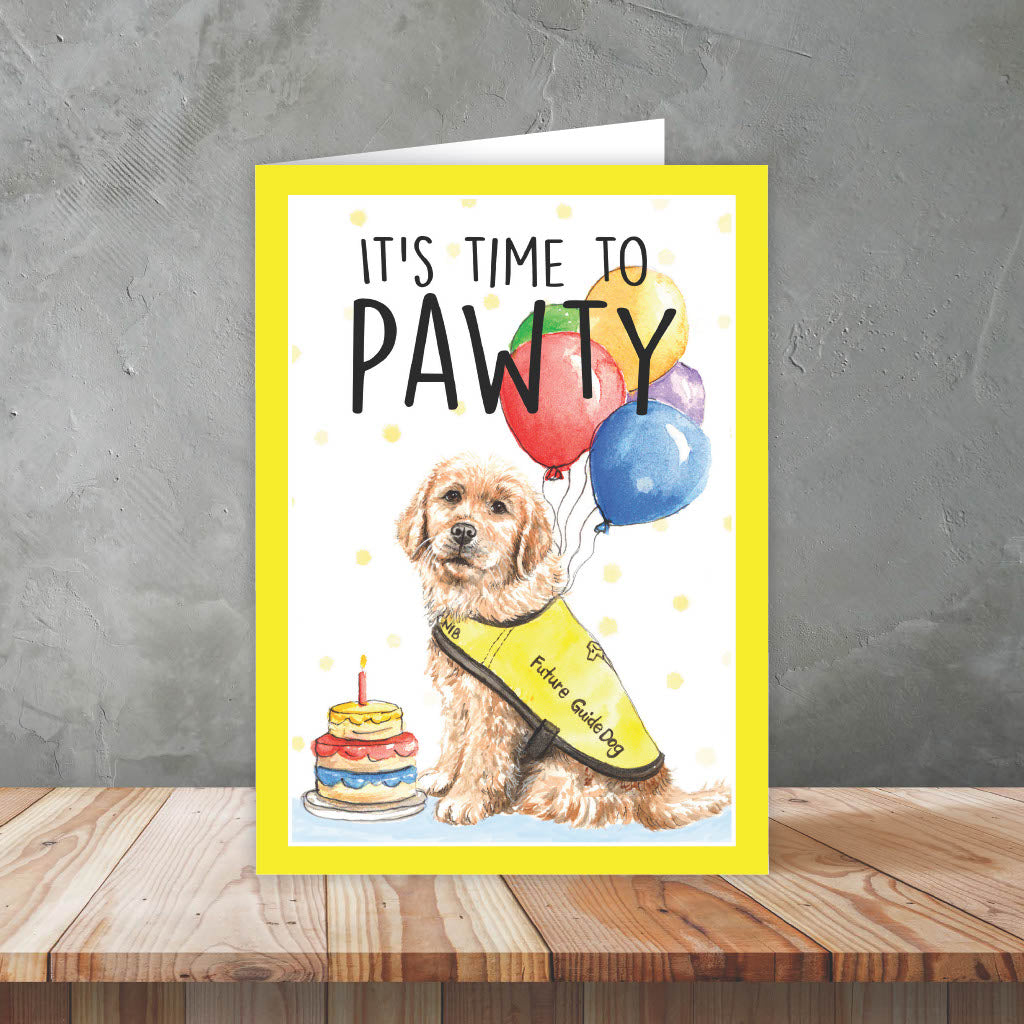 Front of card reads It's Time to Pawty with an illustration of a future guide dog with a birthday cake and balloons 