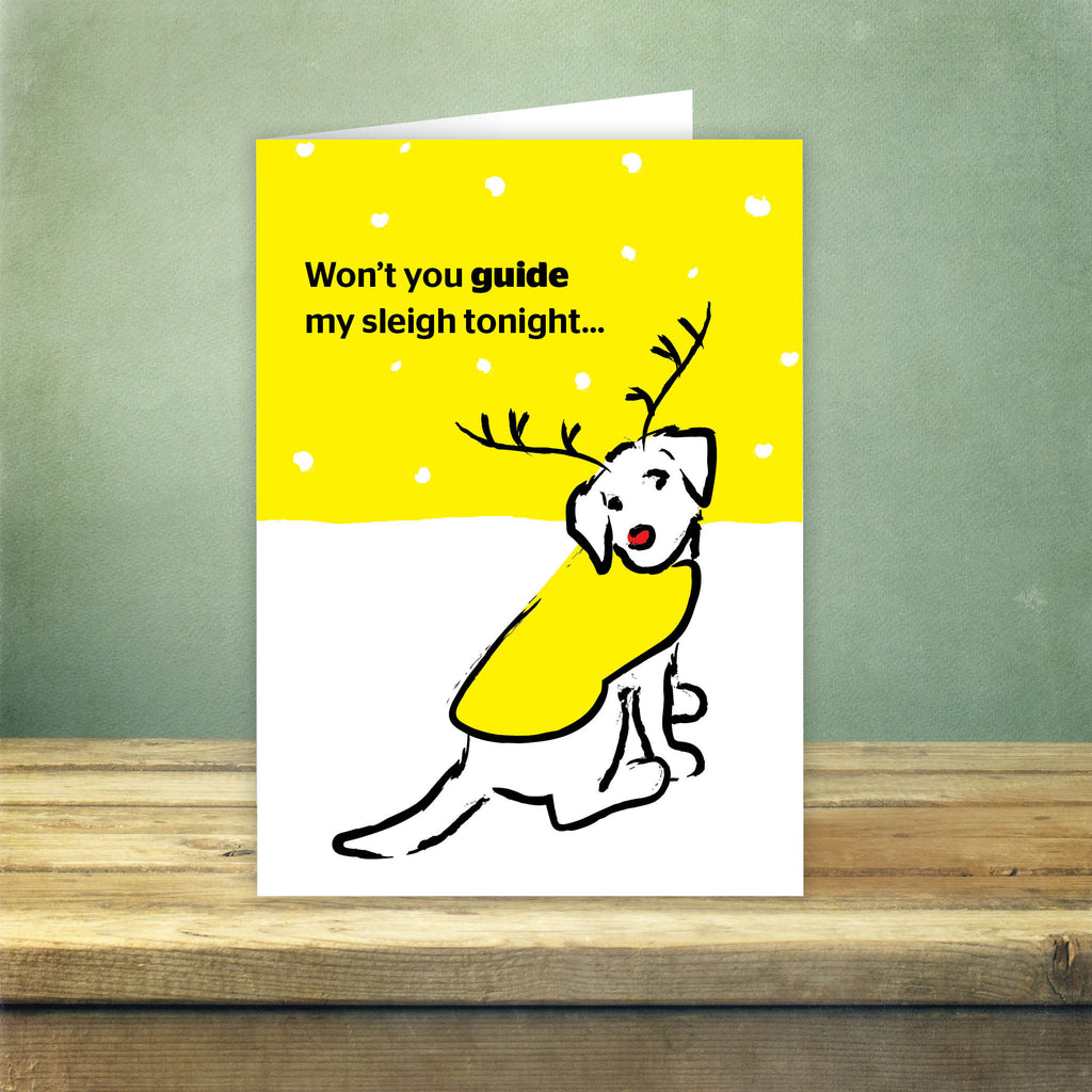Front of card reads: 'Won't you guide my sleigh tonight...' with an illustration of a guide dog with a red nose and reindeer antlers.
